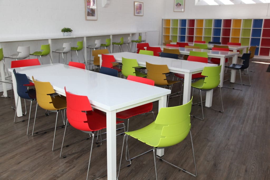 Colourful tables and chairs in a classroom