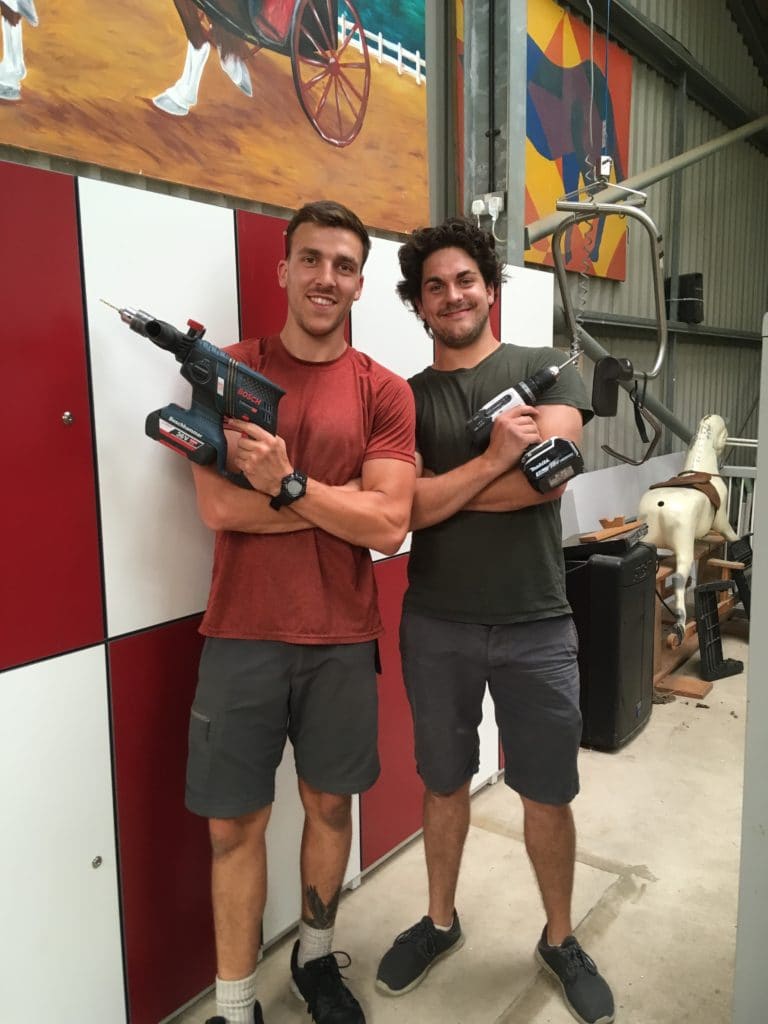 Two men with power tools